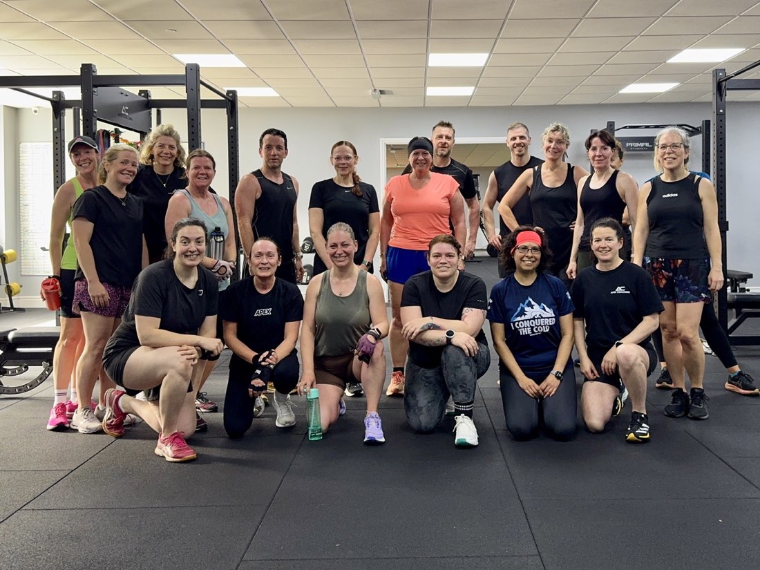 Members of Apex Coaching together on the gym floor in Sale