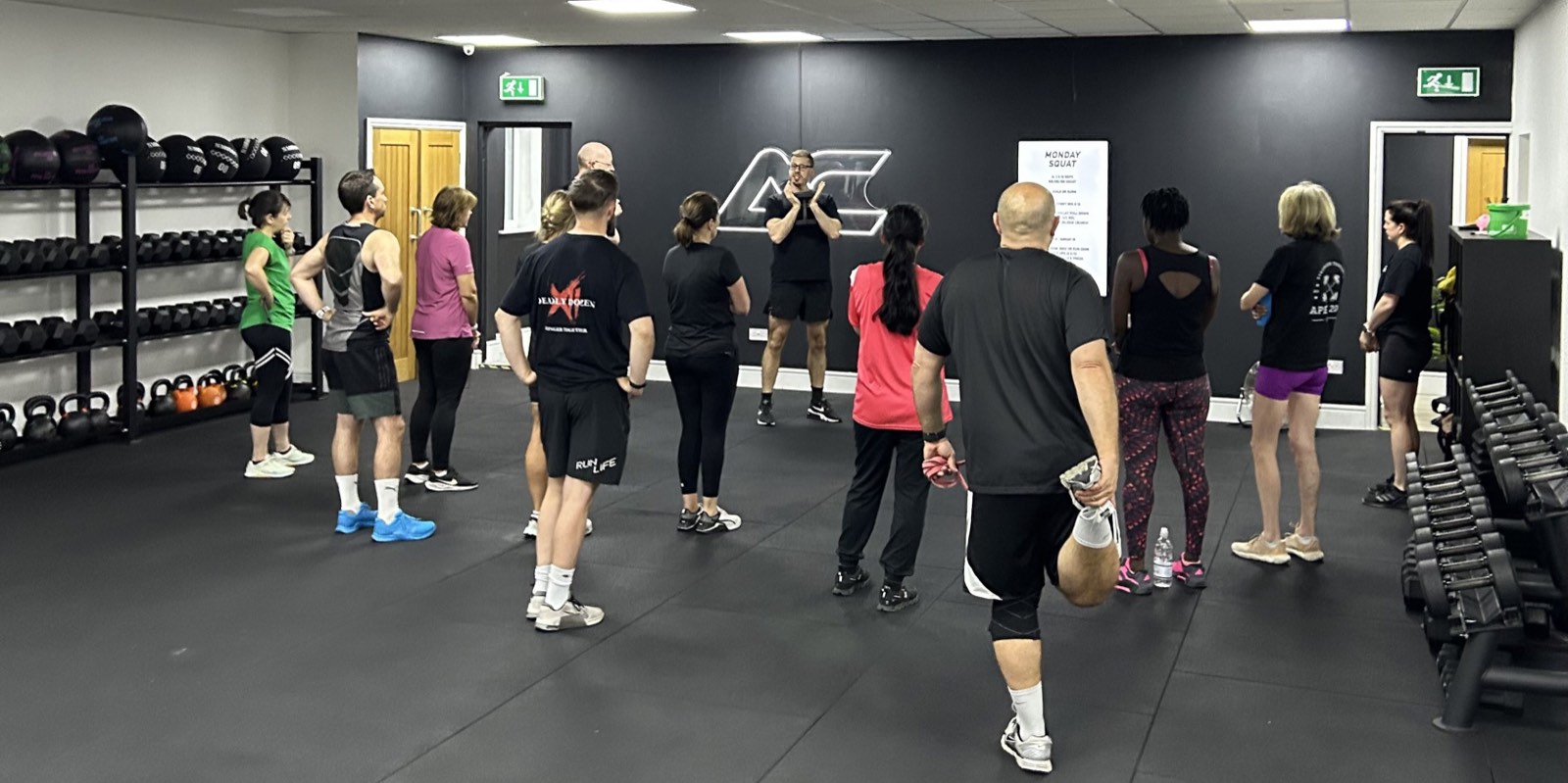A coach briefing the group at the start of a session at Apex Coaching